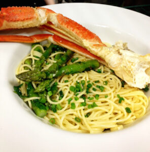 Crab Cluster over Green Vegetables and Garlic Oil Pasta
